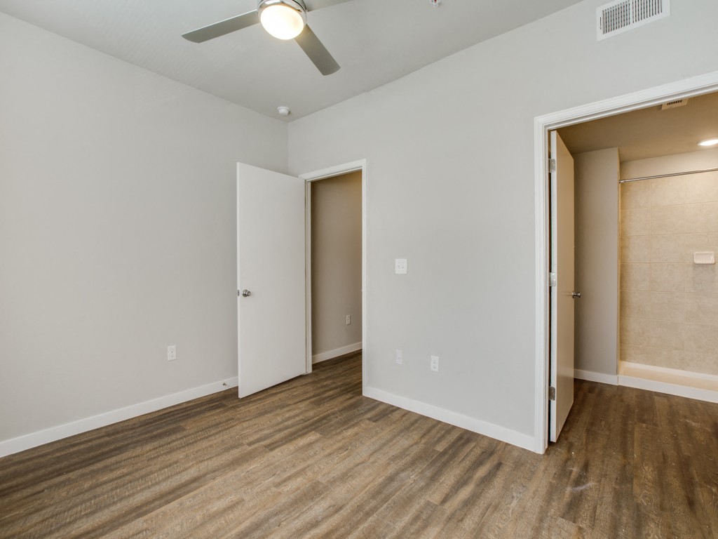 Wood Style Flooring in bedroom at Aviator at Brooks, San Antonio