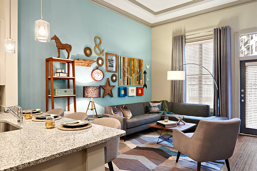 a living room with a kitchen and a table