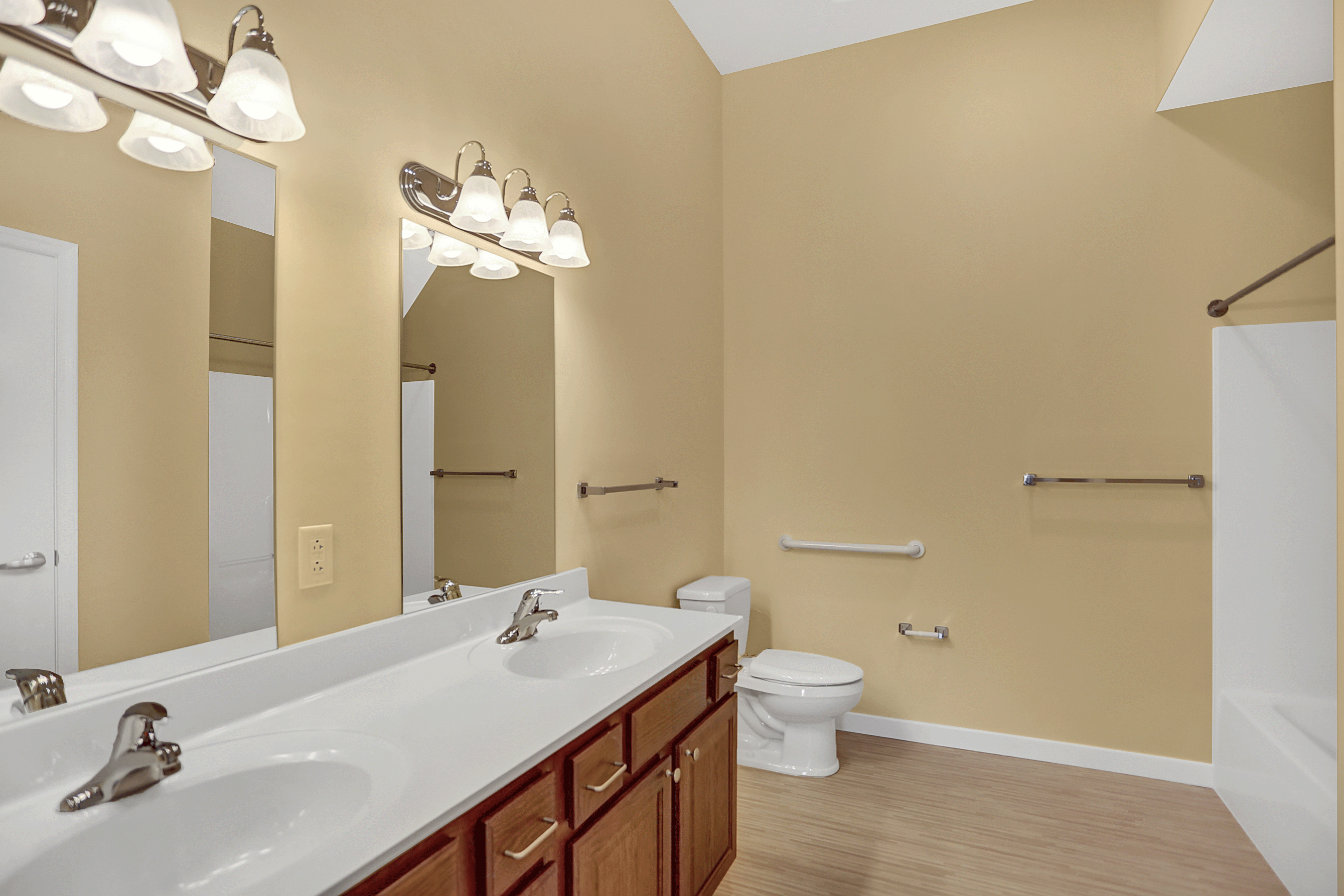 a bathroom with a sink and a toilet and a mirror