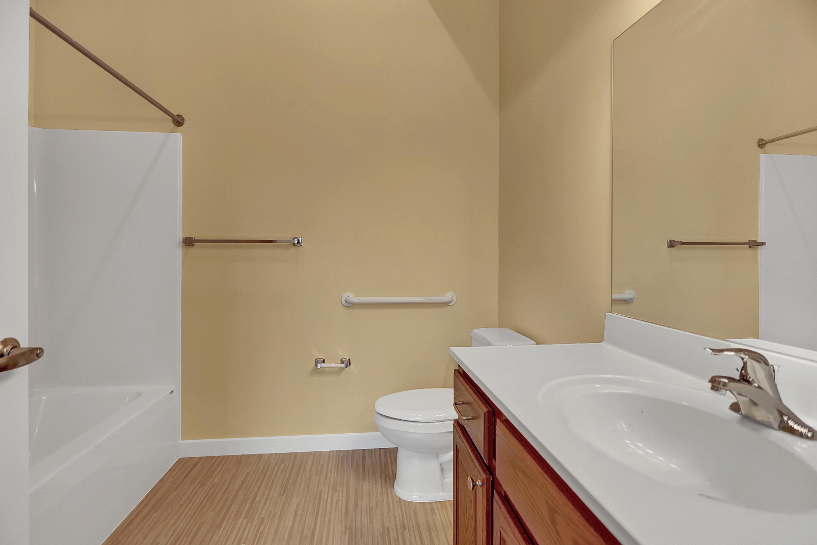 a bathroom with a sink and a toilet and a shower