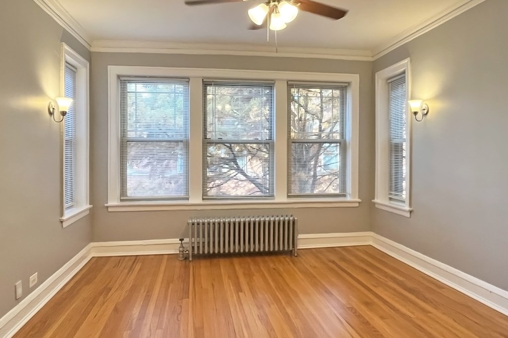 a man riding a skateboard down a sidewalk