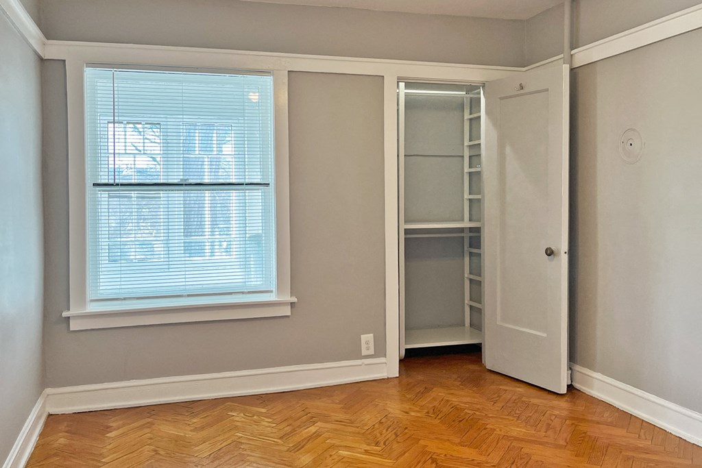 A room with a window and a door.