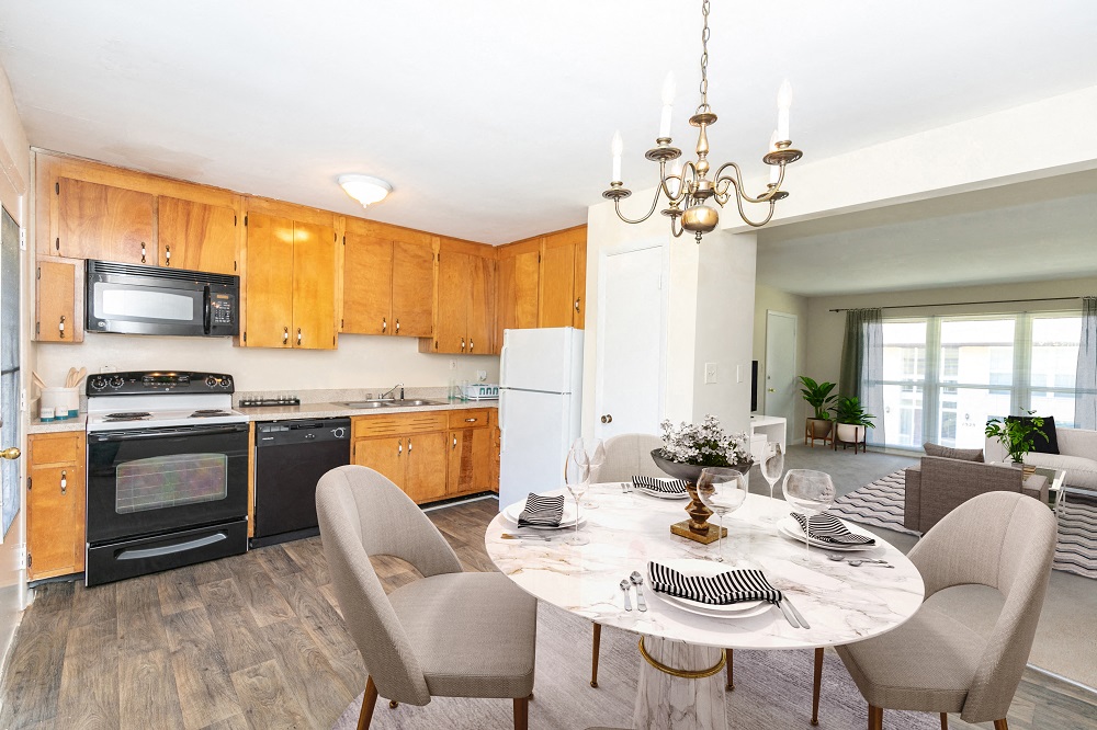 a kitchen and dining room with a table and chairs