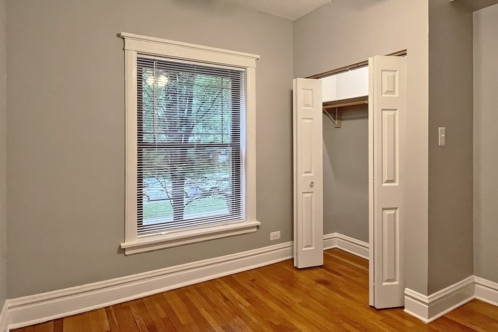 A room with a window and a door.