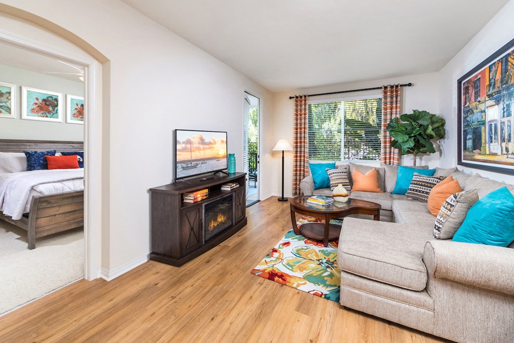 a living room with a couch and a fireplace