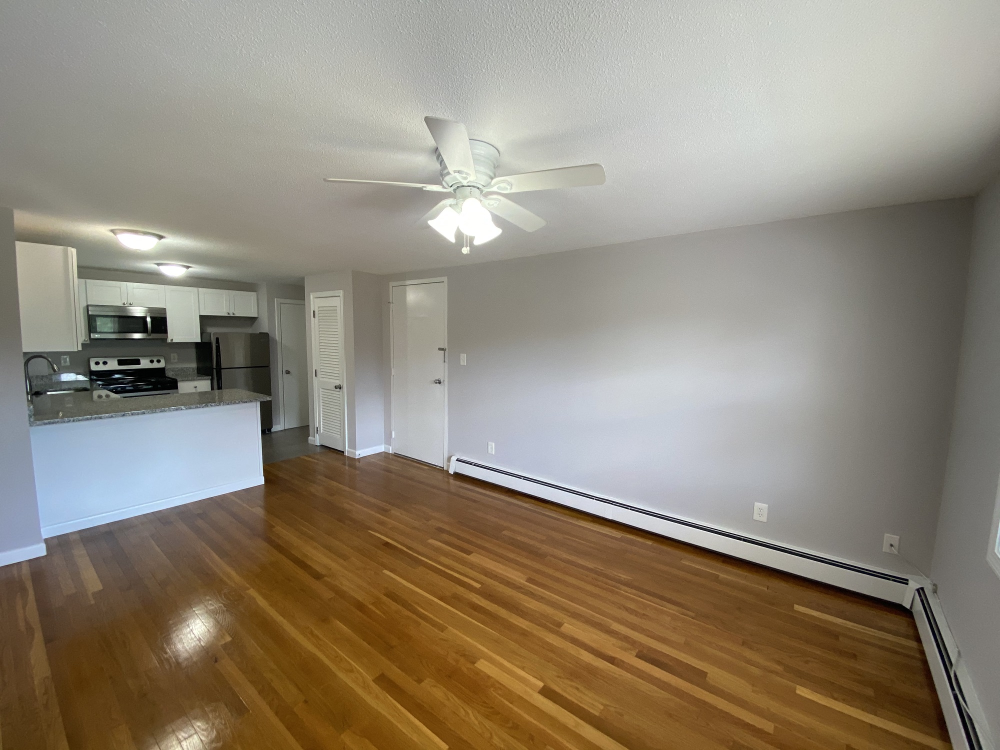 Living Room with Hardwood Floors, Open to Kitchen
