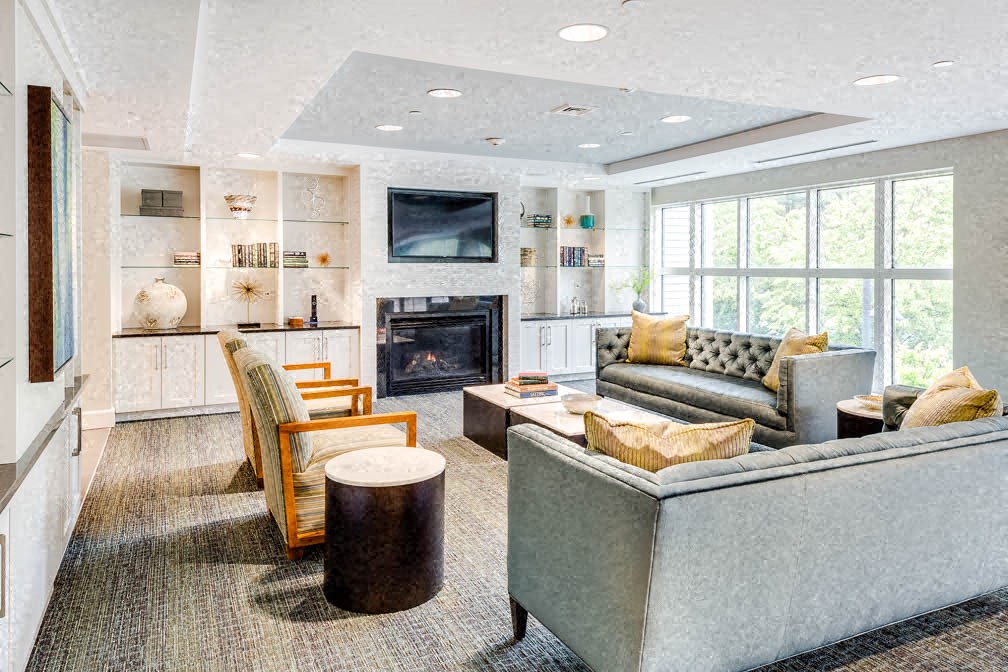 a living room filled with furniture and a fireplace