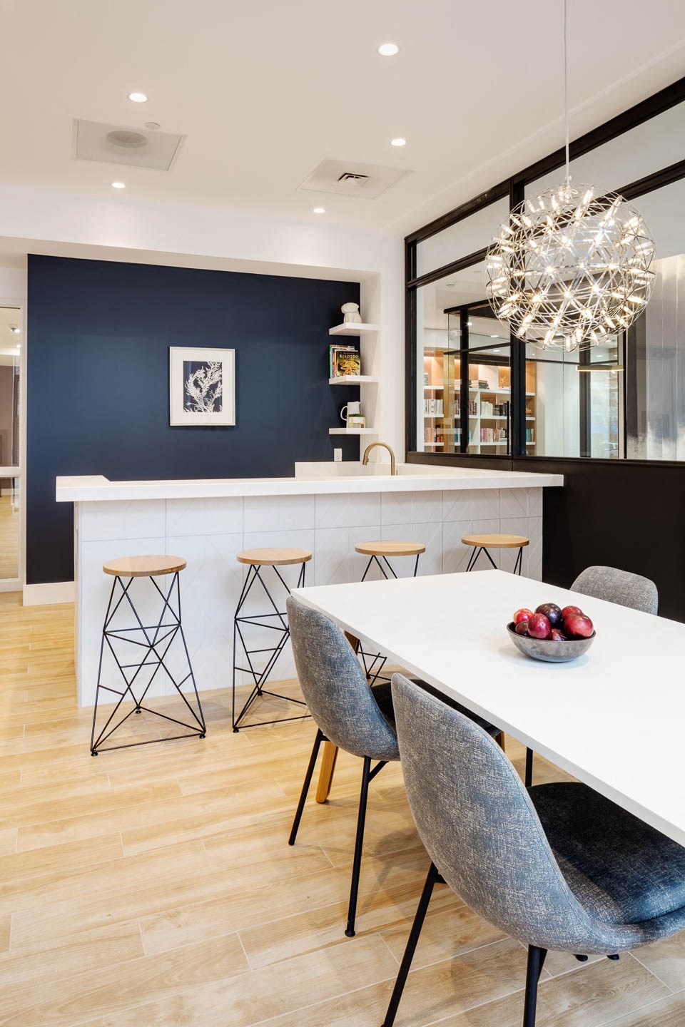 a dining room with a white table and chairs