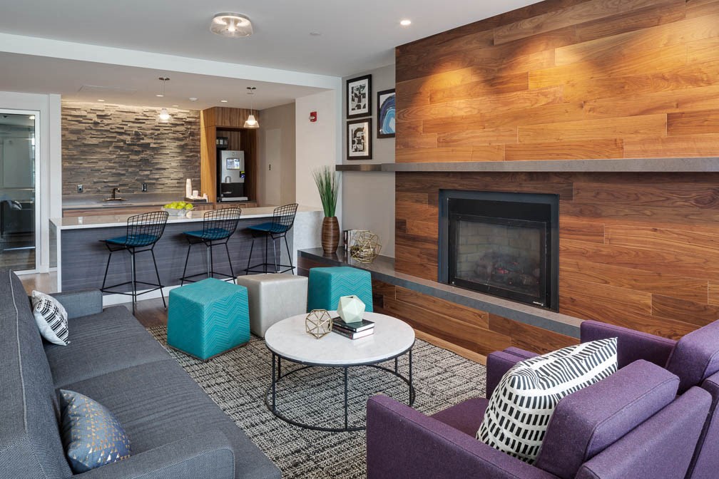 a living room with a fireplace and a table