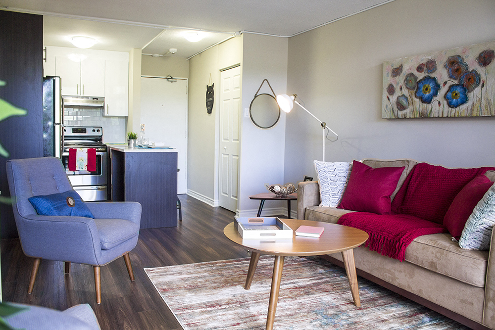 a living room with a couch and a chair and a table