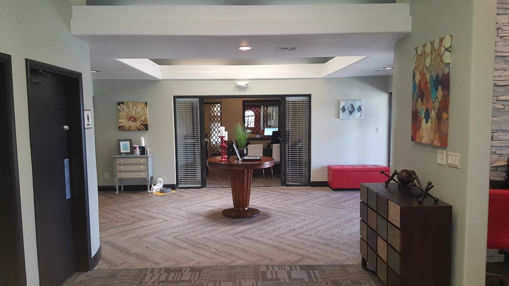 a living room with a table in the middle of it