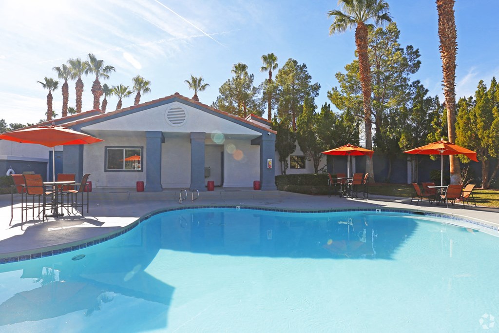 a swimming pool in front of a house