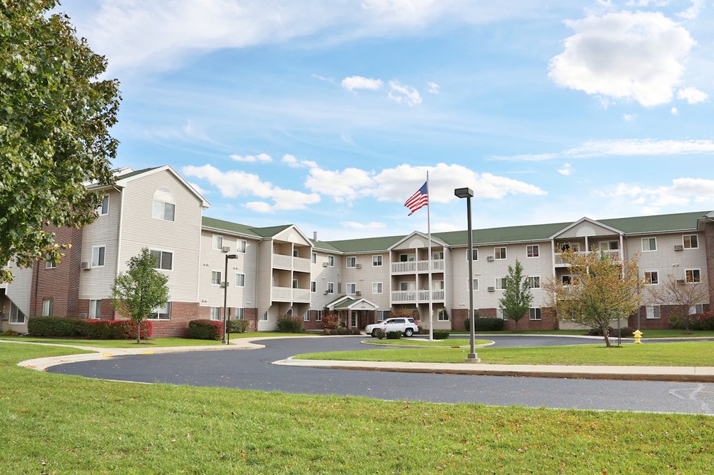 an flag flying in front of an apartment building
