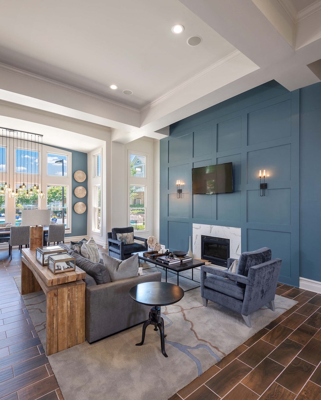 a living room with blue walls and a fireplace