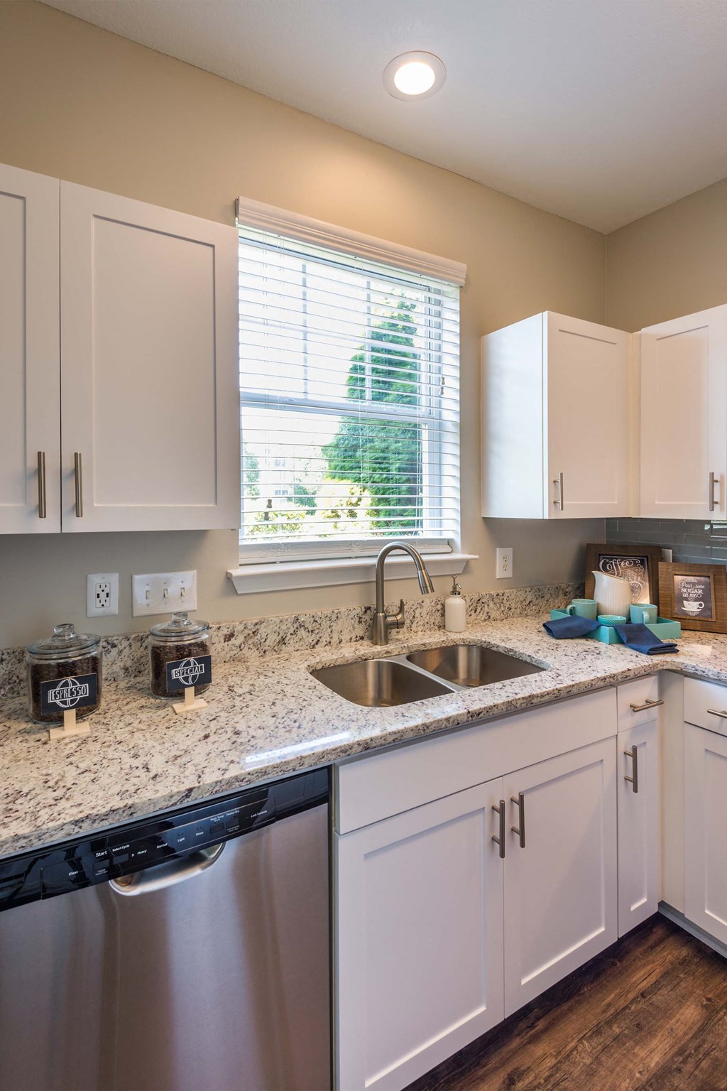 a kitchen with a sink and a window