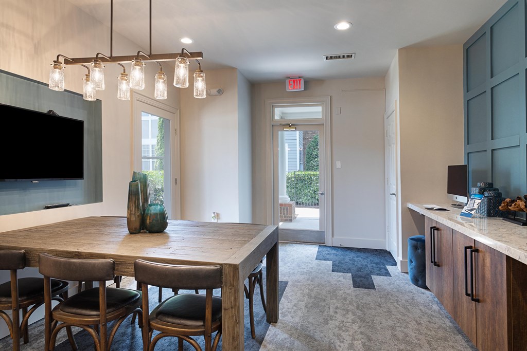 an open kitchen and dining room with a table and chairs