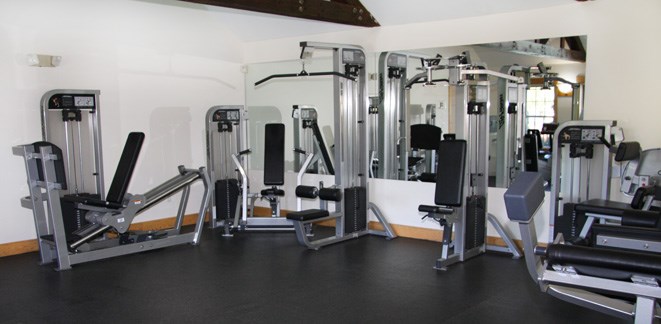 a gym with a lot of exercise equipment
