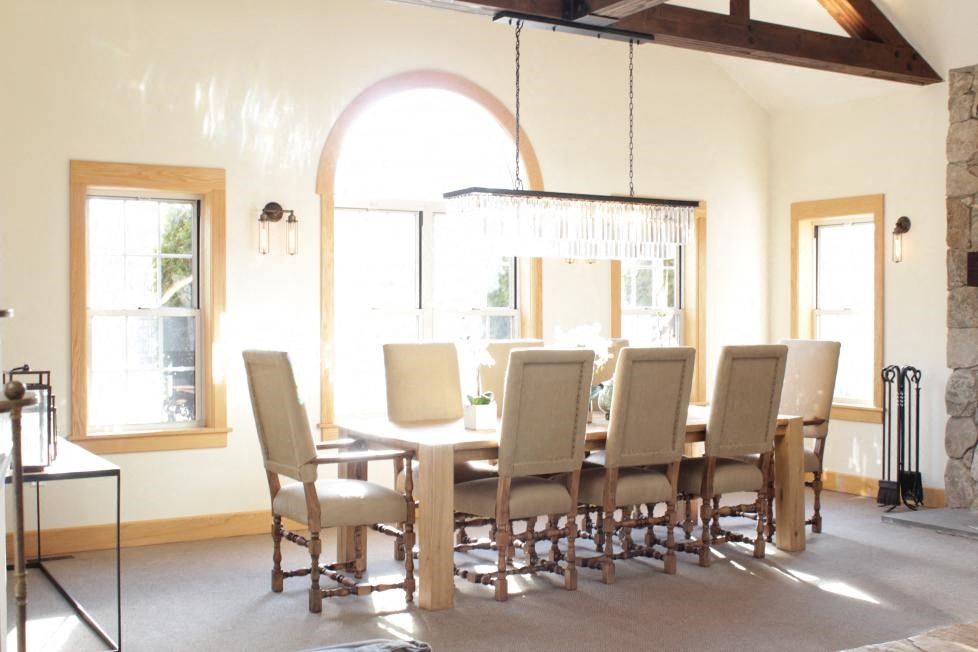 a dining room with a table and chairs