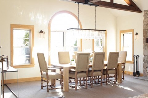 a dining room with a table and chairs