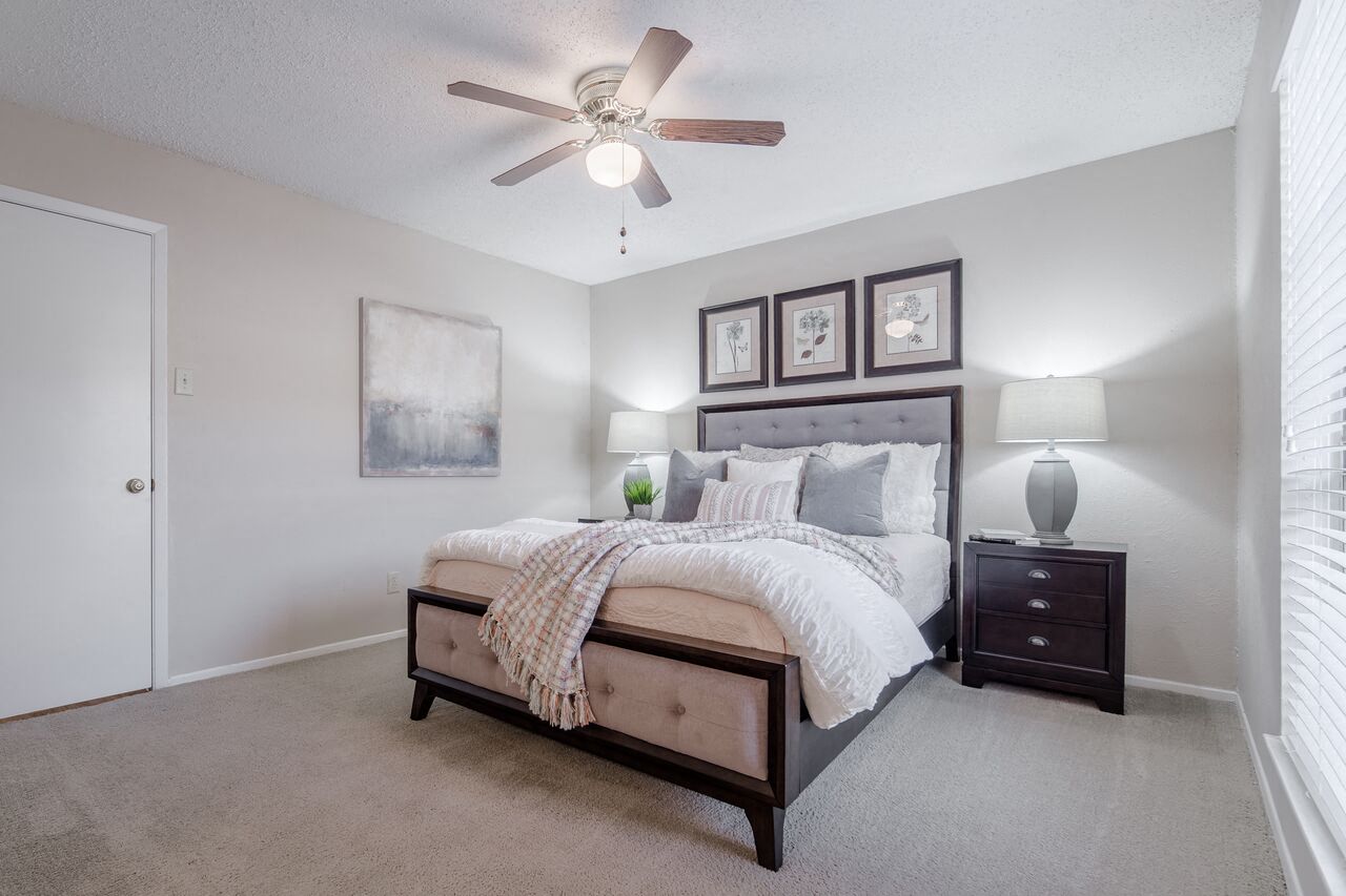 Large bedroom with ceiling fan  at Country Square, Carrollton, TX