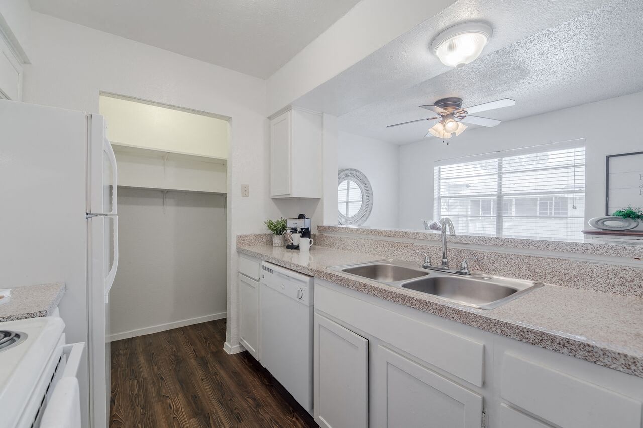 Stainless steel double sink in open kitchen  at Garden Gate, Irving, 75061