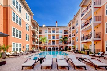 Resort-Inspired Pool and Jacuzzi with Covered Lounge Areas