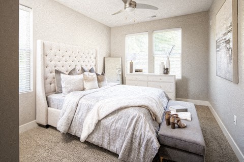 a bedroom with a bed and a dresser