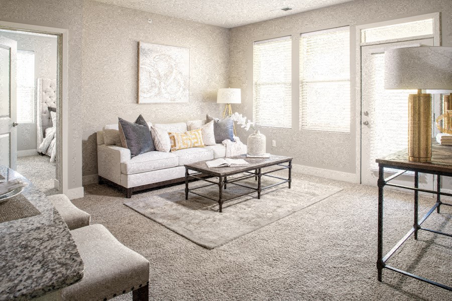 a living room with a couch and a table