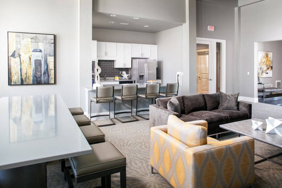 a living room with a kitchen and a dining room
