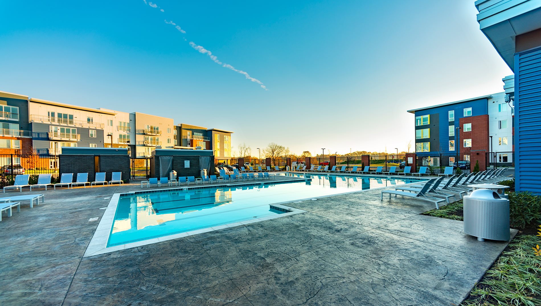 Swimming Pool The Ridge at Robinson Apartments Offers Pool Side Relaxing Area With Easy Chairs