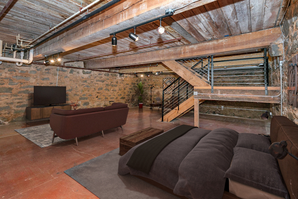 a living room with a couch and a tv in a loft
