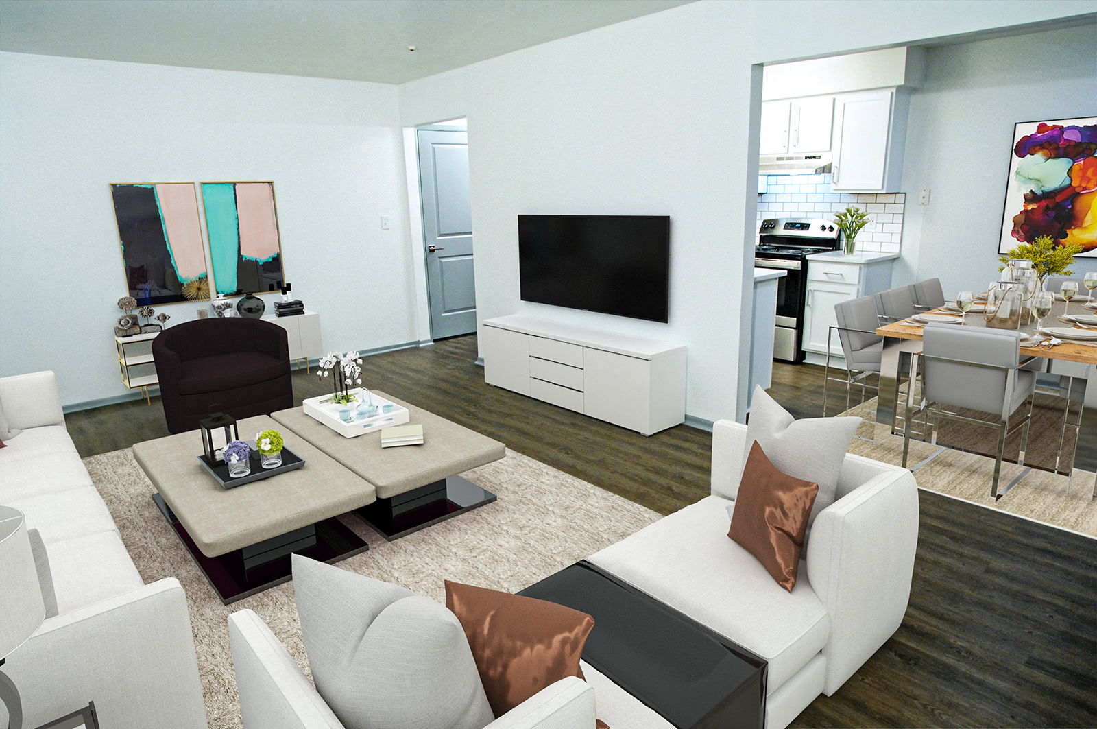 A modern living room with a white sofa set and a television.