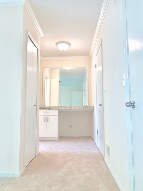 an empty bathroom with a sink and a mirror