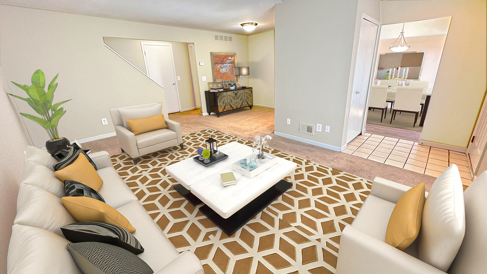 A living room with a white couch and a coffee table.