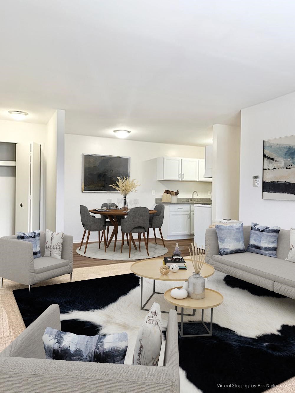 a living room and dining room with a table and chairs