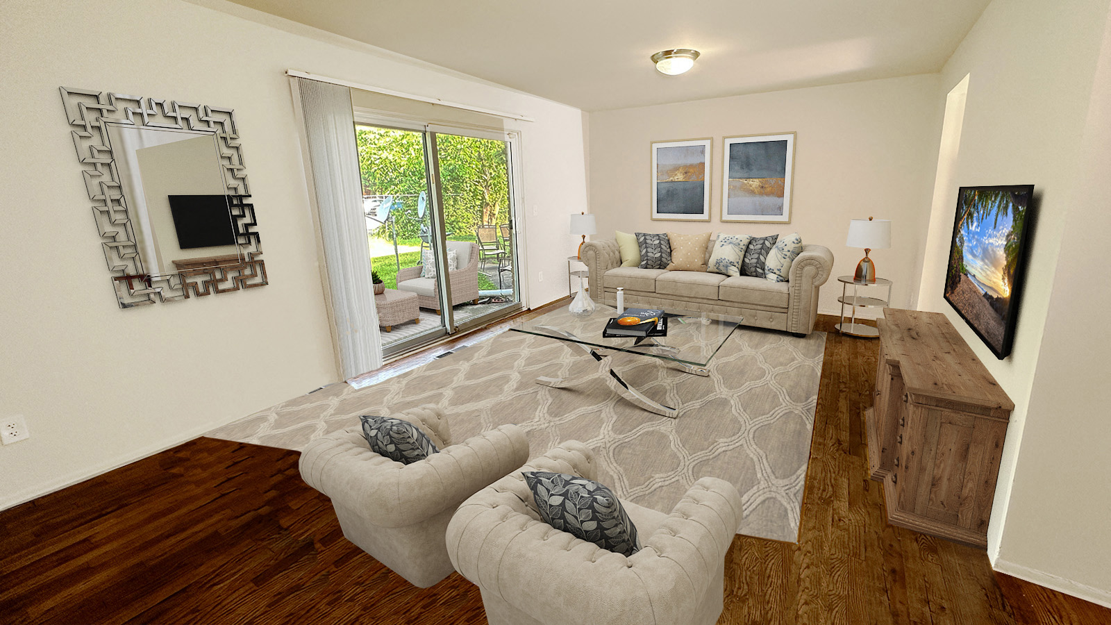 A living room with a grey sofa and a white rug.