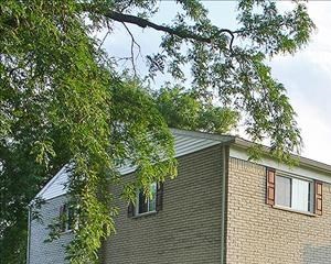 2 bedroom apartments feature patio/balcony space! a large apartment building with a green lawn
