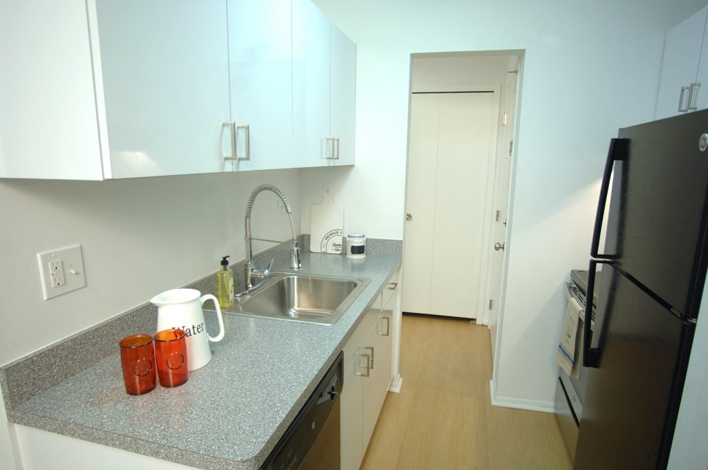 a kitchen with a granite counter top and a sink