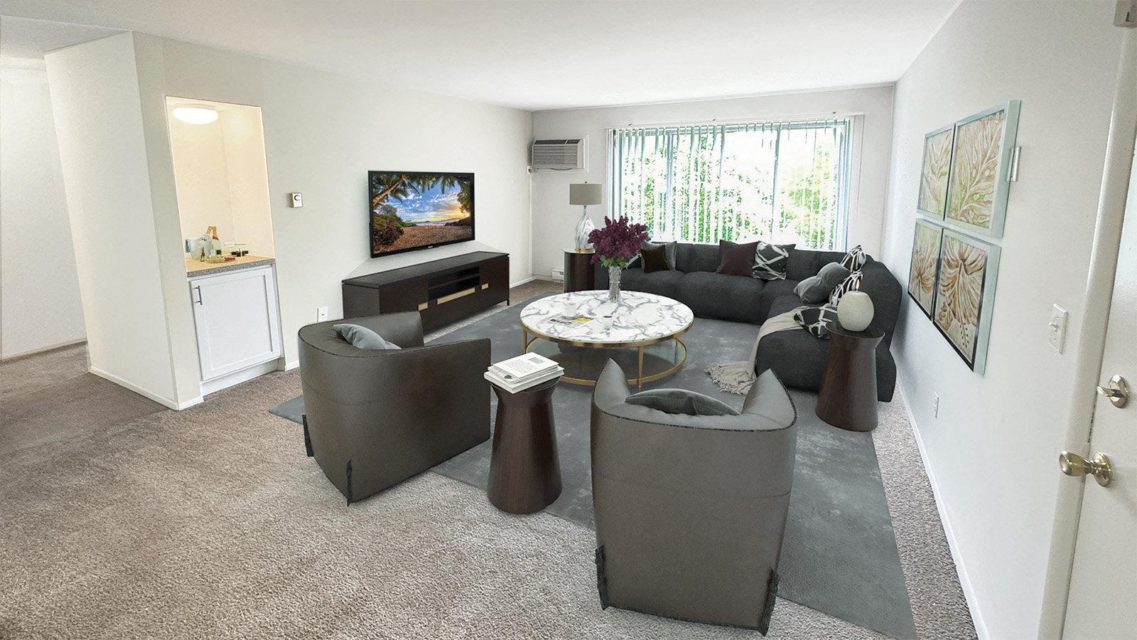 A living room with a grey couch and a television.
