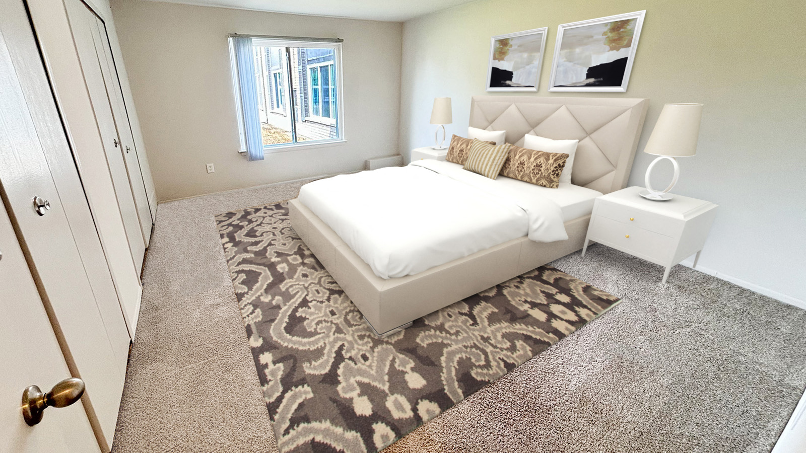 A bedroom with a large bed and a window.