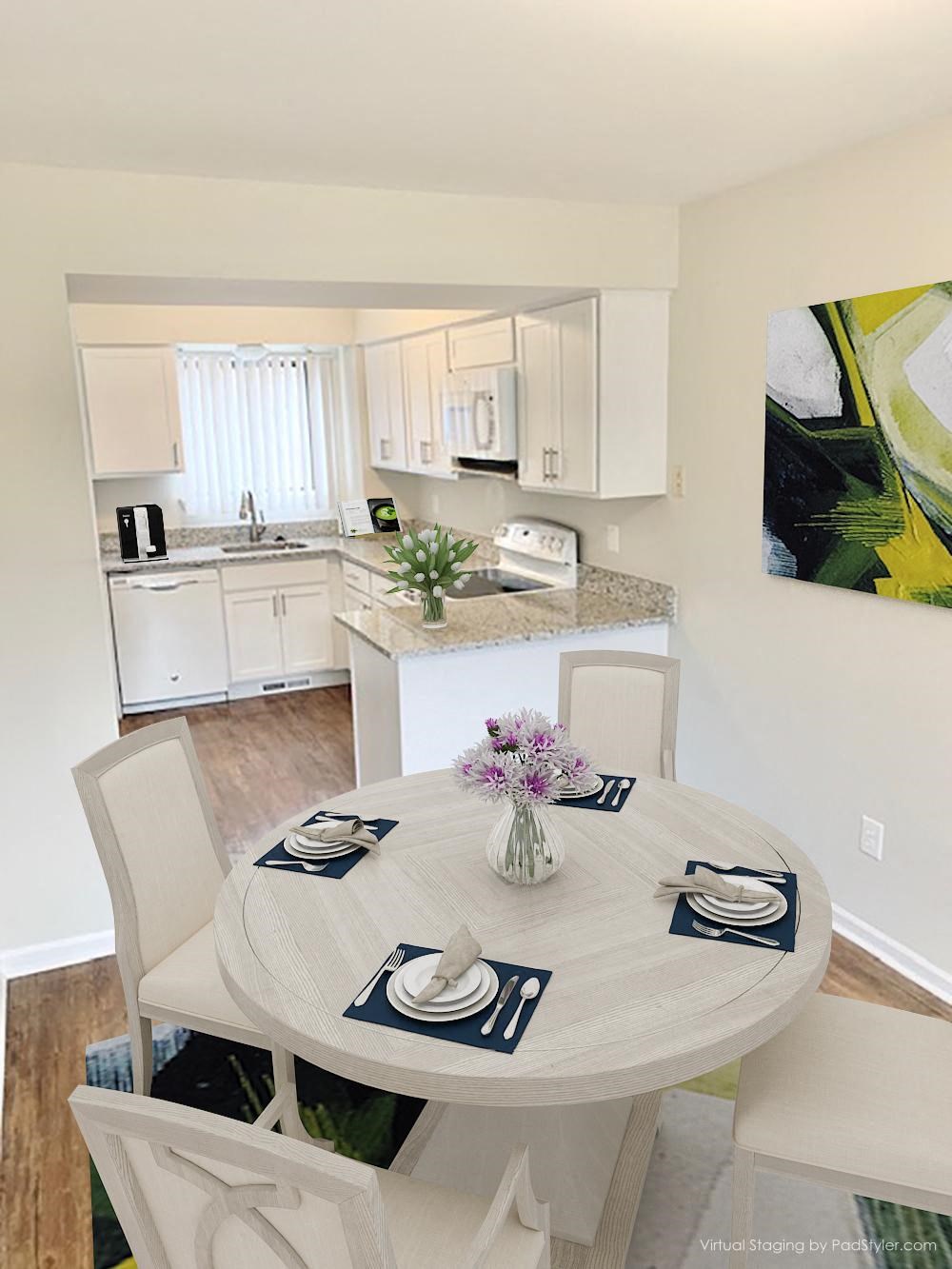 a kitchen and dining room with a table and chairs