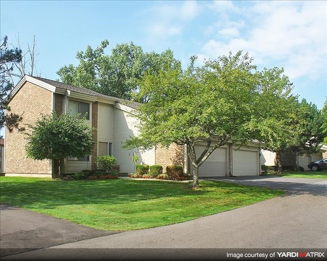 a house with a tree in front of it