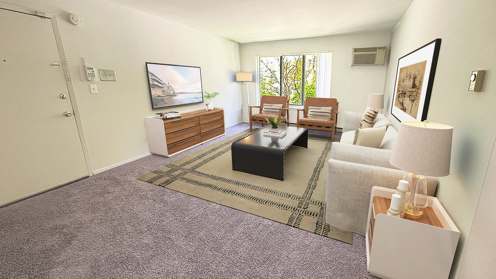 A living room with a grey carpet and furniture.