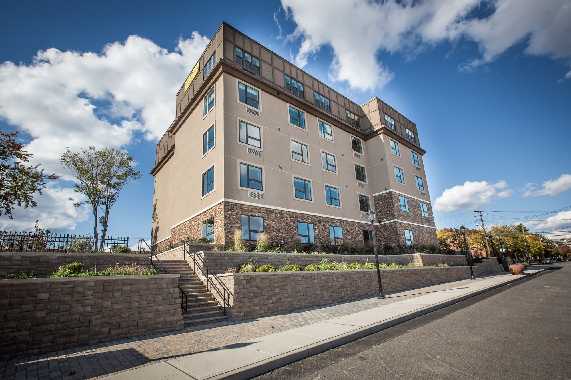 an apartment building on the side of a street