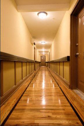 Hallway with hardwood floors