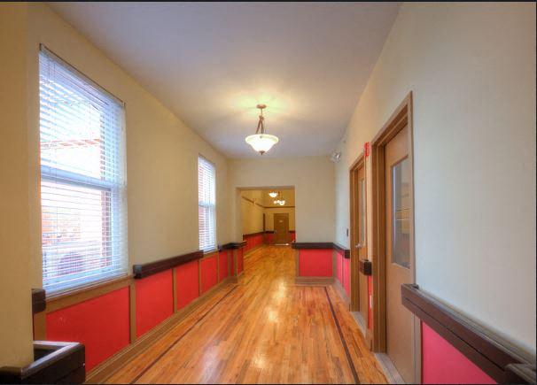 Hallway with hardwood floor