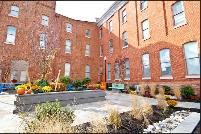 Exterior of courtyard with flowers and garden