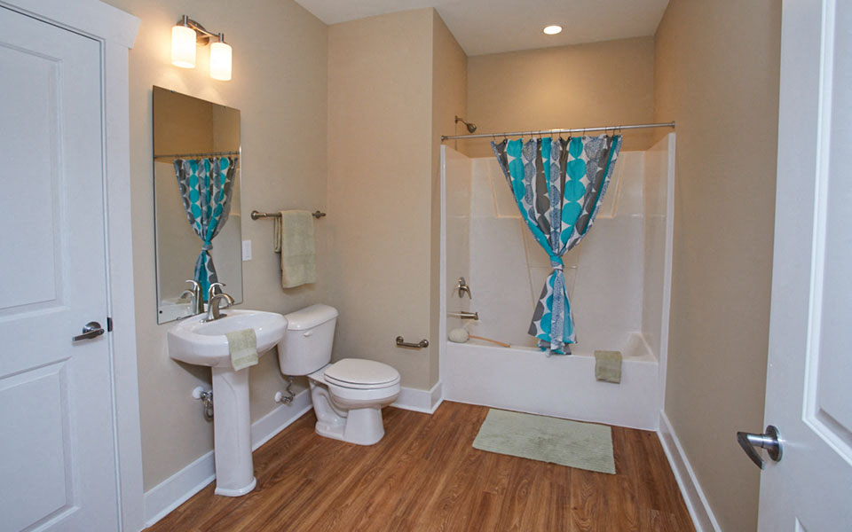 a bathroom with a sink toilet and a shower