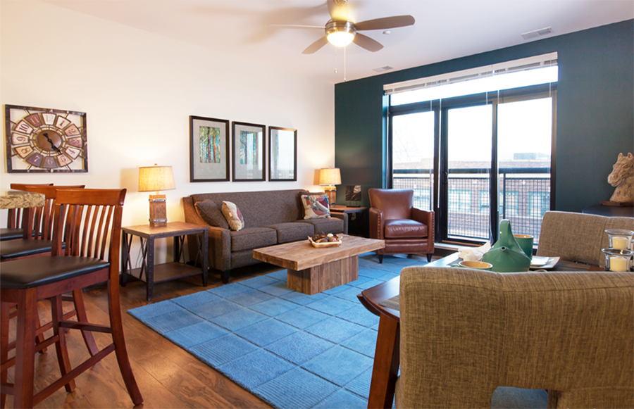 a living room and dining room with a couch and a table