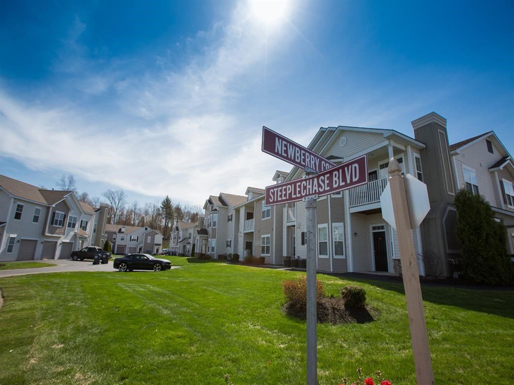 a street sign in front of some houses